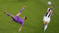 Real Madrid's Cristiano Ronaldo shoots at goal with a overhead kick. (Reuters / Phil Noble)