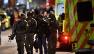 Armed officers attend to an incident near London Bridge in London, Britain, June 4, 2017. REUTERS/Hannah McKay
