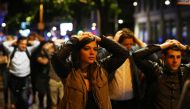 People leave the area with their hands up after an incident near London Bridge in London, Britain June 4, 2017. (REUTERS/Neil Hall)