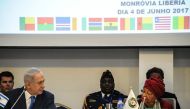 Israel's Prime Minister Benjamin Netanyahu (2-L) looks on as Liberia's President and ECOWAS (Economic Community of West African States) Chairperson Ellen Johnson Sirleaf (R) speaks during the ECOWAS summit on June 4, 2017 in Monrovia.  AFP / Zoom Dosso