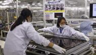 File Photo: Women assemble an Aquos television at Sharp Corp's Tochigi plant in Yaita, north of Tokyo, November 19, 2015. Reuters / Reiji Murai