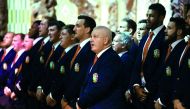 British and Lions rugby head coach Warren Gatland (centre) sings with the rest of the team in the meeting house during a Maori welcoming at Waitangi Treaty Grounds in Waitangi, yesterday.