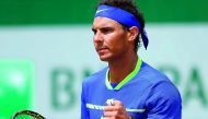 Spain's Rafael Nadal celebrates after winning his match against Spain's Roberto Bautista Agut at the French Open in Paris, yesterday.