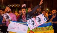 Protesters hold portraits of grassroots leader Nasser Zefzafi during a demonstration June 4, 2017 in Rabat in solidarity with Morocco's neglected Rif region. Nasser Zefzafi, was arrested May 29, 2017 after three days on the run. / AFP / STR.
