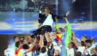 Real Madrid's French coach Zinedine Zidane is tossed by players as they celebrate the team's win, at the Santiago Bernabeu Stadium in Madrid on Sunday. 