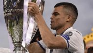 Real Madrid's Portuguese defender Pepe lifts the trophy after Real Madrid won the UEFA Champions League final football match between Juventus and Real Madrid at The Principality Stadium in Cardiff, south Wales, on June 3, 2017. / AFP / JAVIER SORIANO