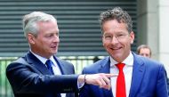 Dutch Finance Minister and Eurogroup President Jeroen Dijsselbloem (right) is greeted by French Economy Minister Bruno Le Maire upon his arrival at the Bercy Finance Ministry in Paris, France, yesterday.