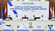 Ahmed Saif Al Sulaiti, Chairman of Woqod (centre) and Mohammed Nasser Al Hajri, Vice Chairman (second right) with other board members during the Extraordinary General Assembly meeting at Woqod headquarters on Tuesday. Pic: Abdul Basit/The Peninsula 