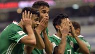 Mexico players celebrate their victory over Honduras during their World Cup 2018 CONCACAF qualifiers football match in Mexico City, on June 8, 2017. / AFP / Pedro Pardo
