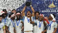 England's players celebrate with the trophy during the awards ceremony after winning the U-20 World Cup final football match between England and Venezuela in Suwon on June 11, 2017. / AFP / JUNG Yeon-Je