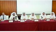 Nasser bin Mohammed Al Mohannadi (left), representative of the Ministry of Economy and Commerce; Mohamed Ahmed Al Obaidly of QC, and other officials at the traders meeting at QC headquarters, yesterday.