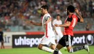 Tunisian forward Youssef Msakni vies for the ball against Egyptian striker Mohamed Ghaly Salah during their African Cup of Nations CAN 2019 preliminary stage qualification football match in Rades on June 11, 2017. / AFP / FETHI BELAID