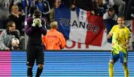 France's goalkeeper Hugo Lloris (L) reacts at the end of the FIFA World Cup 2018 qualification football match between Sweden and France in Solna, Sweden, on June 9, 2017. Sweden won the match 2-1. / AFP / FRANCK FIFE
