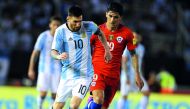 Argentina's Lionel Messi (left) vies for the ball with Chile's Pedro Hernandez during their 2018 FIFA World Cup qualifying match at the Monumental Stadium in Buenos Aires, Argentina, in this March 2017 file photo.
