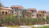 A picture taken on May 21, 2017 shows residential buildings in a gated compound community in a suburb of the Egyptian capital Cairo. AFP / MOHAMED EL-SHAHED