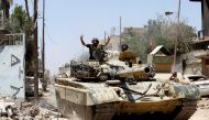 An Iraqi military tank advances towards the Islamic State militants positions in the Old City in western Mosul, Iraq June 18, 2017. REUTERS/Erik De Castro