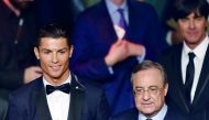 Real Madrid's forward Cristiano Ronaldo (left), winner of the 2014 FIFA Ballon d'Or award for player of the year and Real Madrid's President Florentino Perez posing on stage at the end of the 2014 FIFA Ballon d'Or award ceremony at the Kongresshaus in Zur