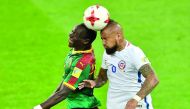 Cameroon's forward Vincent Aboubakar (left) heads the ball with Chile's midfielder Arturo Vidal during the 2017 Confederations Cup group B match at the Spartak Stadium in Moscow on Saturday.