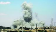 Smoke billows from buildings in the northern Syrian city of Raqqa, yesterday,  during an offensive by US-backed fighters to retake the Islamic State (IS) group bastion.  
