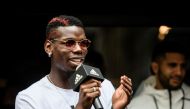 French central midfielder footballer Paul Pogba (L), 24, who plays for Premier League club Manchester United and France's national team, speaks at a promotional event in Hong Kong on June 19, 2017. / AFP / Anthony WALLACE