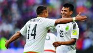 Mexico's forward Javier Hernandez (left) congratulates team-mate Hirving Lozano who scored their second goal during the 2017 Confederations Cup group A match against Russia in Kazan, yesterday.