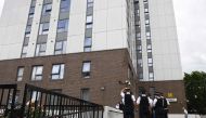 Police officers gather for a briefing outside Dorney Tower residential block on the Chalcots Estate in north London on June 25, 2017. Thousands of residents from 650 London flats were evacuated on June 24 due to fire safety fears in the wake of the Grenfe