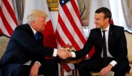 FILE PHOTO: President Trump and French President Emmanuel Macron shake hands. REUTERS/Jonathan Ernst