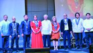 Philippine Ambassador Alan Timbayan (centre), Labour Attaché David Des Dicang (extreme right )and UFOQ Chairman Ressie Fos (extreme left) with the awardees of the first annual AFJQ Gawad Parangal para sa Natatanging Overseas Pinoy awards at City Centre Ro