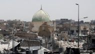 A destroyed mosque is seen among other houses near the Grand Al-Nuri mosque at the frontline in the Old City of West Mosul, Iraq June 27, 2017. REUTERS/Erik De Castro/File Photo