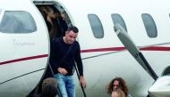 Barcelona legend and Al Sadd captain  Xavi Hernandez (centre) and Charles Pujol (right) arrive at Rosario's Airport, Santa Fe Province, Argentina yesterday to attend the wedding of Argentine football star and player of Spanish Barcelona, Lionel Messi.