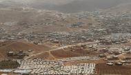 FILE PHOTO: A general view shows Syrian refugee camps dotted in and around the Lebanese town of Arsal, near the border with Syria, Lebanon September 21, 2016. REUTERS/Mohamed Azakir/File Photo
