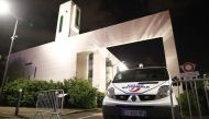 A police vehicle is stationed outside a mosque June 29, 2017 in the Paris suburb of Creteil after a man tried to drive a car into a crowd front of the Islamic religious facility. AFP / Benjamin Cremel 
