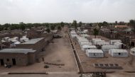 This file photo taken on April 26, 2017 shows a Nigerian army vehicle patrolling a street in the town of Banki, northeastern Nigeria. Nigerians who fled to northern Cameroon after attacks of Boko Haram insurgents are flowing back into northeastern Nigeria