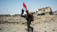 Members of Iraq's elite Rapid Response Division, patrol in the Shifa neighbourhood, on the west bank of Mosul, on July 1, 2017, where they are battling some of the last members of the Islamic State (IS) jihadist group in the city. (AFP / Fadel SENNA)