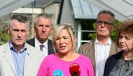 Sinn Fein leader Michelle O'Neill (C) gives a statement to the press at Stormont Castle in Belfast on July 3, 2017 as talks continue to form a power-sharing government in Northern Ireland.  AFP / Paul Faith