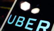 The logo of Uber is seen on an iPad, during a news conference to announce Uber resumes ride-hailing service, in Taipei