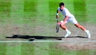 Serbia's Novak Djokovic sets off to hit  a return against Latvia's Ernests Gulbis during their men's singles third round match during the 2017 Wimbledon Championships at The All England Lawn Tennis Club in Wimbledon yesterday.  Djokovic beat Gulbis  6-4, 