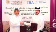 Fahad Rashid Al Kaabi, CEO of Manateq (left), shaking hands with Hamad Mohammed Esmael Al Emadi, CEO of Ismail Bin Ali Group, at the signing ceremony in Doha, yesterday.  Pic: Abdul Basit/The Peninsula 