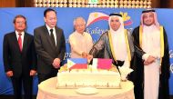 H E Dr Mohammed bin Abdul Wahed Al Hammadi, Minister of Education and Higher Education; Ibrahim Fakhroo, Director of Protocol; and Alan Timbayan (centre), Philippines Ambassador, with other officials during the Philippines National Day celebrations. Pic: 