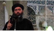 This file grab taken from a propaganda video released on July 5, 2014 by al-Furqan Media allegedly shows the leader of the Islamic State (IS) jihadist group, Abu Bakr al-Baghdadi.  (AFP / AL-FURQAN MEDIA)
