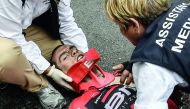 Australia's Richie Porte receives medical assistance after falling during the 181,5 km ninth stage of the 104th edition of the Tour de France cycling race on Sunday between Nantua and Chambery.