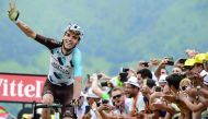 French rider Romain Bardet celebrates as he crosses the finish line at the end of the 214,5 km 12th stage of the 104th Tour de France. 