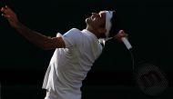 Switzerland's Roger Federer serves to Czech Republic's Tomas Berdych during their men's singles semi-final match on the eleventh day of the 2017 Wimbledon Championships at The All England Lawn Tennis Club in Wimbledon, southwest London, on July 14, 2017. 