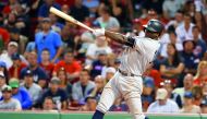 New York Yankees shortstop Didi Gregorius follows through on a RBI single against the Boston Red Sox during the 16th inning at Fenway Park in Boston, MA, USA on Saturday.