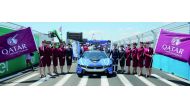 Qatar Airways hostesses with Sam Bird, winner of the 2017 New York City ePrix, at the Brooklyn Cruise Terminal.