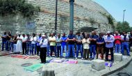 Palestinians pray outside Lions’ Gate, a main entrance to the Al Aqsa mosque compound in Jerusalem’s Old City, yesterday, in protest against new Israeli security measures implemented at the holy site the previous week. 
