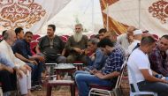 Relatives of 17-year-old Mohammed Jawawdeh, who was shot dead by an Israeli security guard, gather in a mourning tent in the capital Amman on July 24, 2017. AFP / Khalil Mazraawi