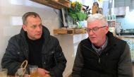 Peter Blenkiron and Philip Nagle react as they sit in a cafe in Cardinal George Pell's hometown, just days before the Vatican treasurer's first court appearance on historic sex charges, in the town of Ballarat, located west of the southern city of Melbour