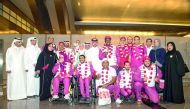 The Qatari delegation for the 2017 World Para Athletics Championships pose for a photograph with Secretary General of the Qatar Olympic Committee (QOC) Dr Thani bin Abdulrahman Al Kuwari upon their arrival at the Hamad International Airport on Monday. Qat