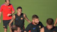 Barcelona player Neymar jokes with teamates during a training session at Barry University in Miami, Florida, on July 27, 2017, two days before their International Champions Cup friendly match against Real Madrid. (AFP / HECTOR RETAMAL)

